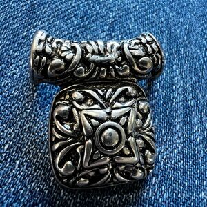 Textured antique silver tone metal w/black accents pendant